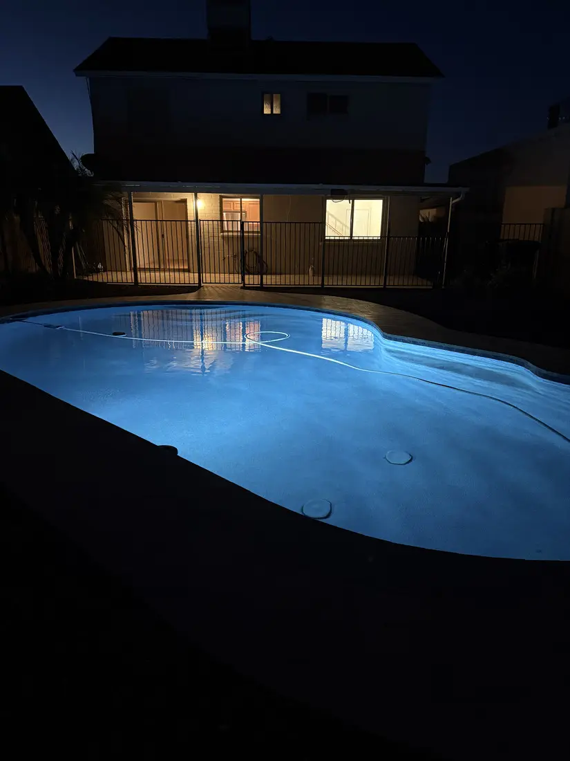 The pool lit at dusk